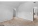 A bright bedroom features neutral walls and carpet, with closet and bathroom access for convenience at 149 Elkins Blvd, Locust Grove, GA 30248