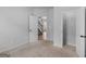 This bedroom reveals neutral carpet, blank walls, an open closet, and lots of sunlight at 149 Elkins Blvd, Locust Grove, GA 30248