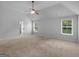Spacious primary bedroom with large windows and a ceiling fan at 149 Elkins Blvd, Locust Grove, GA 30248