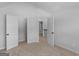 A bright bedroom features neutral walls and carpet, with closet and bathroom access for convenience at 149 Elkins Blvd, Locust Grove, GA 30248