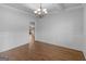Bright dining room boasts hardwood floors and elegant wainscoting, open to the kitchen at 149 Elkins Blvd, Locust Grove, GA 30248