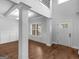 Elegant foyer with hardwood floors, soaring ceilings, and a grand staircase at 149 Elkins Blvd, Locust Grove, GA 30248