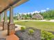Cozy front porch featuring brick columns, decorative shrubbery, and manicured garden beds at 149 Elkins Blvd, Locust Grove, GA 30248
