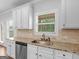 Bright kitchen features granite countertops, stainless steel appliances, and ample counter space at 149 Elkins Blvd, Locust Grove, GA 30248