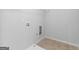 The laundry room is well lit and ready for your appliances at 149 Elkins Blvd, Locust Grove, GA 30248