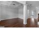 Spacious living area boasting hardwood floors and an elaborate coffered ceiling at 149 Elkins Blvd, Locust Grove, GA 30248