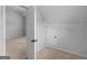 Large storage area with neutral walls and carpet, equipped with shelving for organization at 149 Elkins Blvd, Locust Grove, GA 30248