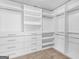 Spacious walk-in closet with custom shelving and drawers at 149 Elkins Blvd, Locust Grove, GA 30248