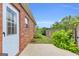 Backyard view showcasing the patio, privacy fence and a small garden at 401 Buckboard Ln, Locust Grove, GA 30248