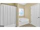 Bathroom featuring a soaking tub and shower with tile flooring at 401 Buckboard Ln, Locust Grove, GA 30248