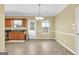 Inviting dining area with tile floors, a chandelier, and natural light from a window at 401 Buckboard Ln, Locust Grove, GA 30248