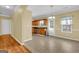 Bright dining area with tile floors, a chandelier, and a view into the kitchen at 401 Buckboard Ln, Locust Grove, GA 30248