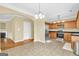 Eat-in kitchen features stainless steel appliances, granite countertops and tile flooring at 401 Buckboard Ln, Locust Grove, GA 30248
