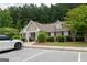 Community clubhouse featuring craftsman details, brick veneer, and ample parking at 3511 Brockenhurst Dr, Buford, GA 30519