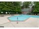 Community pool with surrounding chairs and well maintained landscaping at 3511 Brockenhurst Dr, Buford, GA 30519