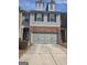 Charming townhome with brick accents and a two-car garage at 3511 Brockenhurst Dr, Buford, GA 30519