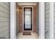 Welcoming front porch with a stylish front door and brick accents at 3511 Brockenhurst Dr, Buford, GA 30519