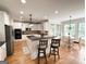 Spacious kitchen with stainless steel appliances, granite counters, and bar stool seating at 99 Oakwind Pt, Acworth, GA 30101