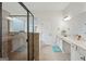 Spa like bathroom with a large glass enclosed shower, soaking tub, double vanity, and neutral color palette at 3225 Alhambra Cir, Hampton, GA 30228