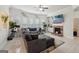 Bright living room with tile floors, large sectional sofa, ceiling fan, and ample natural light at 3225 Alhambra Cir, Hampton, GA 30228