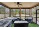 Screened-in porch with ceiling fan and view of the backyard at 3225 Alhambra Cir, Hampton, GA 30228