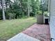 Side yard with green lawn, and a shed at 581 N Fairfield Dr, Peachtree City, GA 30269