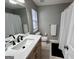 Clean bathroom with a vanity and shower-tub combo with a curtain at 581 N Fairfield Dr, Peachtree City, GA 30269