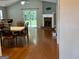 Bright living room with hardwood floors, a fireplace, and sliding glass doors that lead to a backyard at 581 N Fairfield Dr, Peachtree City, GA 30269
