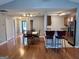 Expansive living room with hardwood floors, an open floor plan and convenient access to both the kitchen and backyard at 581 N Fairfield Dr, Peachtree City, GA 30269