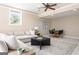 Finished basement with a sectional sofa, game table, and neutral carpet at 450 Riverwalk, Mcdonough, GA 30252