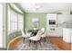 Cozy breakfast nook featuring bay window, white cabinetry, and modern decor at 450 Riverwalk, Mcdonough, GA 30252