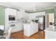 Bright kitchen with stainless steel appliances, center island, and white cabinetry at 450 Riverwalk, Mcdonough, GA 30252