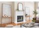 Stylish living room with fireplace, hardwood floors, and neutral decor at 450 Riverwalk, Mcdonough, GA 30252