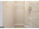 Walk-in closet with wall-mounted metal shelving and neutral carpeting offers an abundance of storage at 450 Riverwalk, Mcdonough, GA 30252