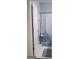 Cozy bathroom with blue patterned shower curtain and updated flooring at 405 Mallory Cir, Loganville, GA 30052