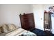 Bedroom featuring a mirror, dresser, dark rug and door at 405 Mallory Cir, Loganville, GA 30052