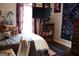 Cozy bedroom featuring a queen-sized bed, a bookshelf with a TV and a dresser at 405 Mallory Cir, Loganville, GA 30052