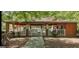 Outdoor community pavilion with picnic tables and grills surrounded by shady trees at 405 Mallory Cir, Loganville, GA 30052