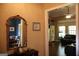 Inviting foyer with decorative mirror and a view into the dining and living rooms at 405 Mallory Cir, Loganville, GA 30052