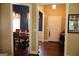 Open foyer leading to a dining room with a chandelier and living area at 405 Mallory Cir, Loganville, GA 30052