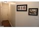 Hallway with hardwood floors and artwork at 405 Mallory Cir, Loganville, GA 30052