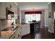 Eat in kitchen featuring white cabinets, granite countertops and stainless steel appliances at 405 Mallory Cir, Loganville, GA 30052