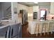 Eat in kitchen with white cabinetry, stainless steel appliances, and hardwood floors at 405 Mallory Cir, Loganville, GA 30052