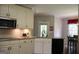 Eat in kitchen with white cabinets and granite countertops at 405 Mallory Cir, Loganville, GA 30052