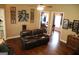 Spacious living room with hardwood floors and an open view to the dining area at 405 Mallory Cir, Loganville, GA 30052