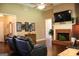 Comfortable living room with a brick fireplace and access to other rooms at 405 Mallory Cir, Loganville, GA 30052