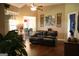 Bright living room featuring an open layout, hardwood floors, and modern decor at 405 Mallory Cir, Loganville, GA 30052