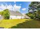 Extensive backyard with lush greenery, providing ample space for recreation at 2545 Lake Royale Dr, Riverdale, GA 30296