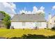 Spacious backyard featuring a patio area with outdoor seating at 2545 Lake Royale Dr, Riverdale, GA 30296