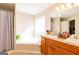 Bright bathroom featuring a soaking tub, and double sinks at 2545 Lake Royale Dr, Riverdale, GA 30296